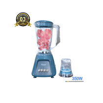 Mixeur OSCAR OSC-28PP-A posé sur un plan de travail avec fruits et graines autour