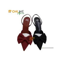 Escarpins Zara à nœud posés sur fond blanc, vue latérale