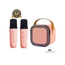 Kit Karaoké Enfant K12 portable rose comprenant deux microphones sans fil et une enceinte Bluetooth 6W avec poignée de transport