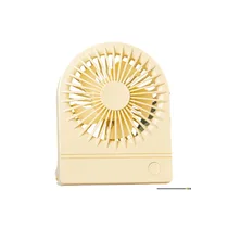 Mini ventilateur portable YASE YS2202A de couleur jaune, ultra-compact, avec grille de protection et bouton unique de contrôle