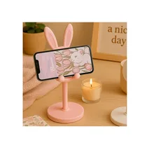 Présentation d'un téléphone posé sur le support de téléphone bureau lapin