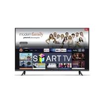 Téléviseur DSTAR S-32A1 installé dans un salon moderne