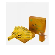 Boîte dorée de sachets de Café aphrodisiaque Royal King Honey par Bio Herbs, montrant l'emballage individuel des sticks