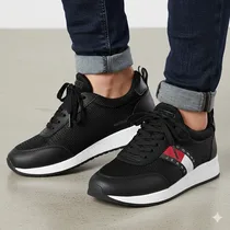 Baskets Tommy grises élégantes pour homme, semelle blanche et détails rouges.