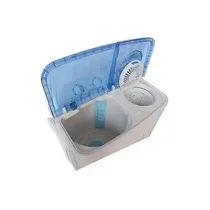 Intérieur de la cuve de lavage Binatone 9Kg avec filtre à peluches.